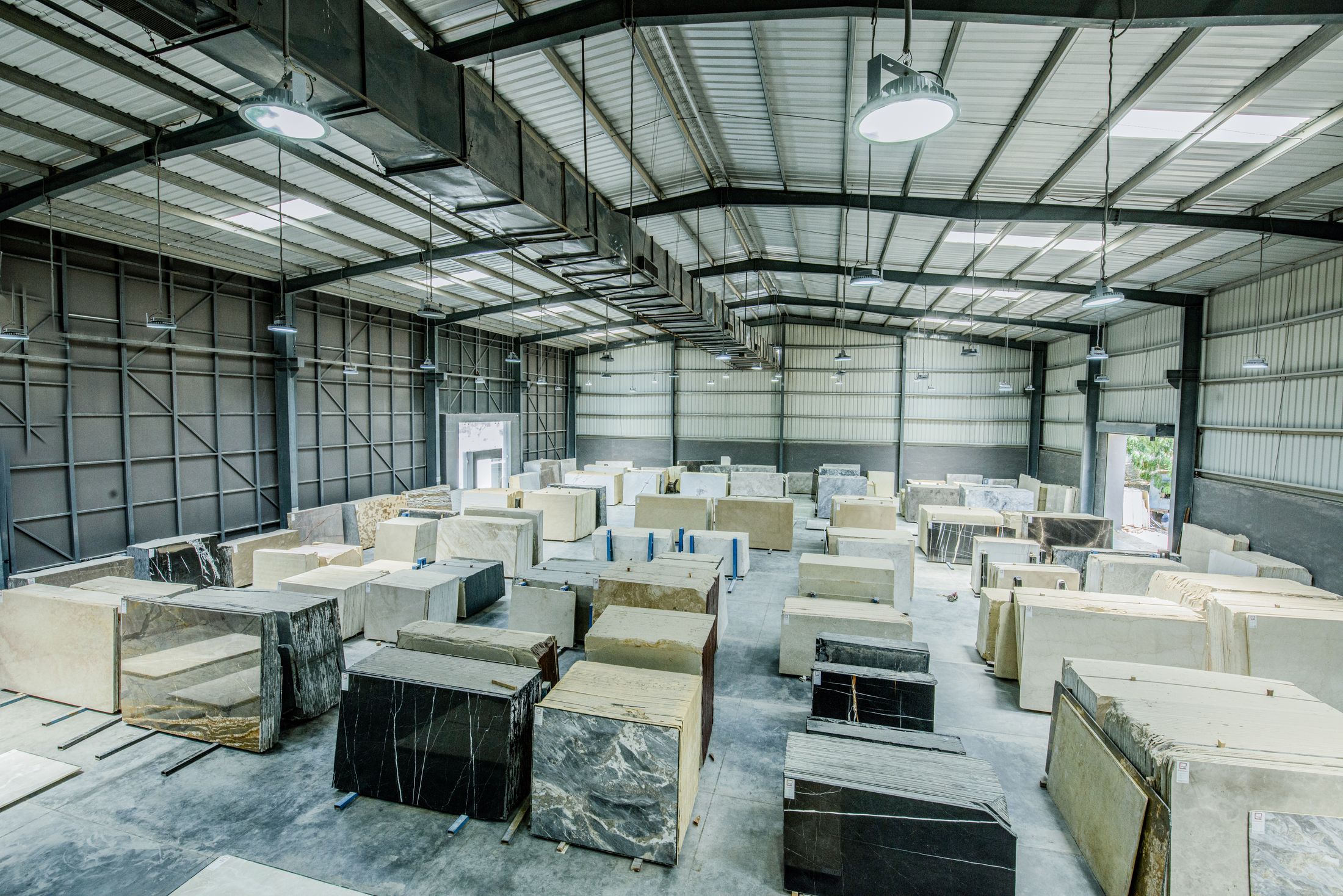 Stone slabs organized in a material warehouse